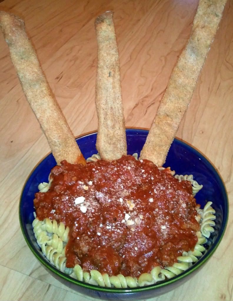 Rotini with sauce and grissini