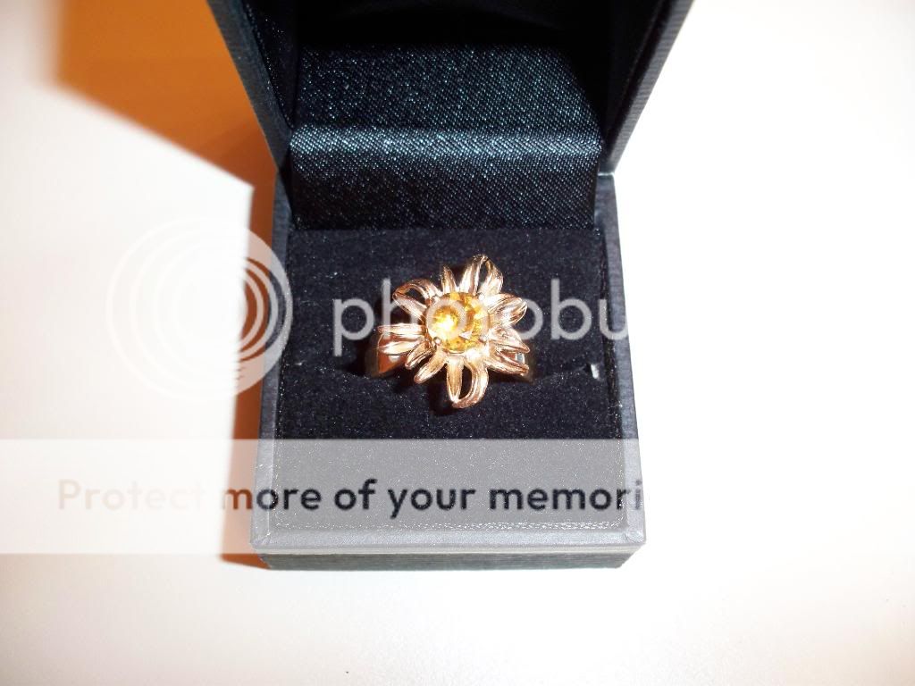 The 4 prong set solitaire citrine stone is approximately 7 mm.